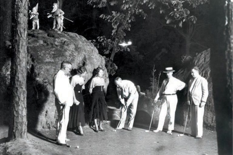 Garnet Carter putting the ball at Tom Thumb mini golf course; Photo Courtesy of Chattanooga Public Library