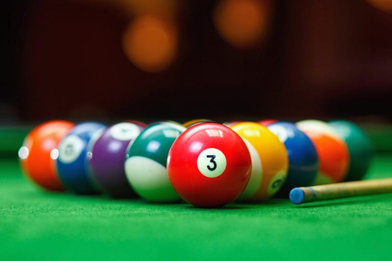 billiards balls racked up on a table