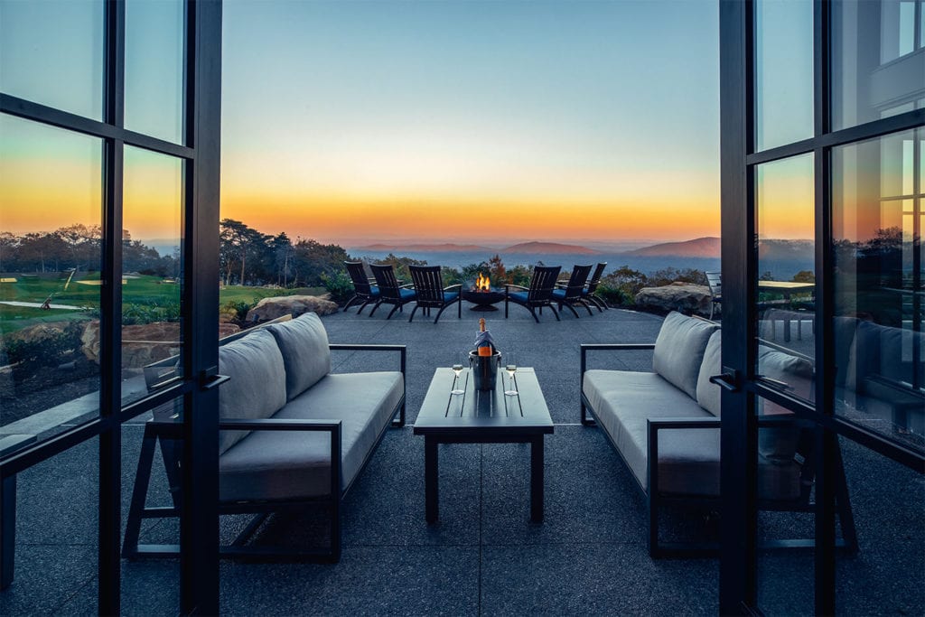 outdoor seating area with beautiful views of the sunset at McLemore; Photo by Lanewood Studio