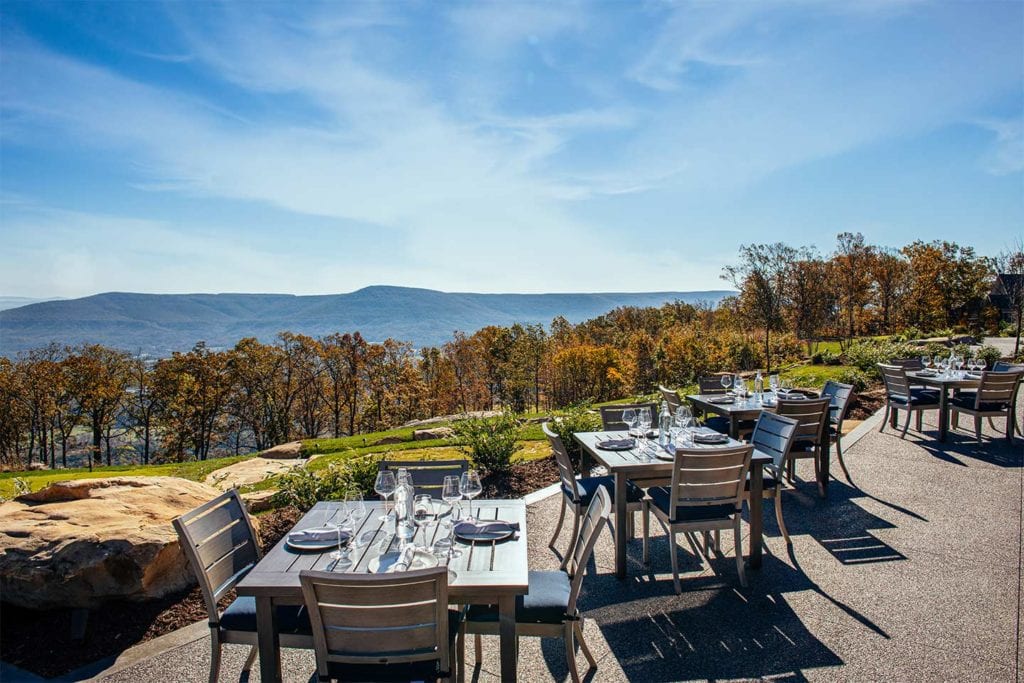 Outdoor dining area with a beautiful view at the Creag at McLemore; Photo by Lanewood Studio