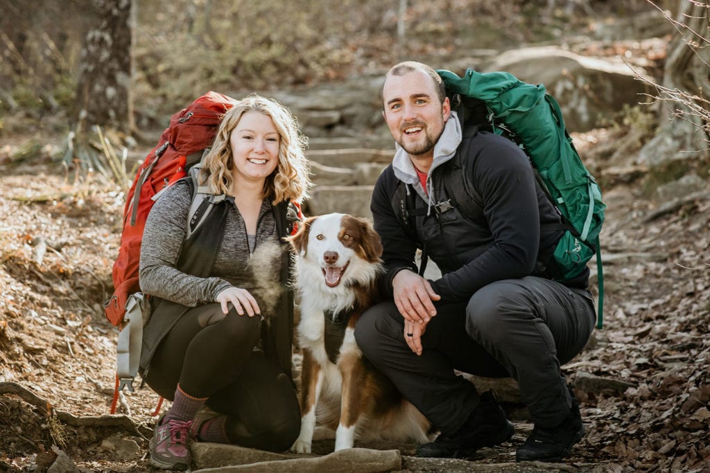 couple hiking with their dog; Photo by Sarah Unger