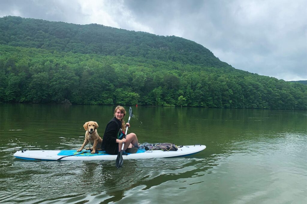 dog and lady paddleboarding with river canyon adventures of chattanooga