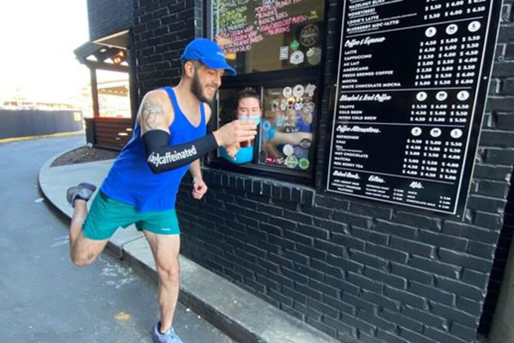 Runner getting coffee from Be Caffeinated