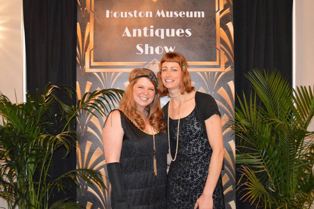Women dressed in 1920's attire at the Houston Museum's Antique Show