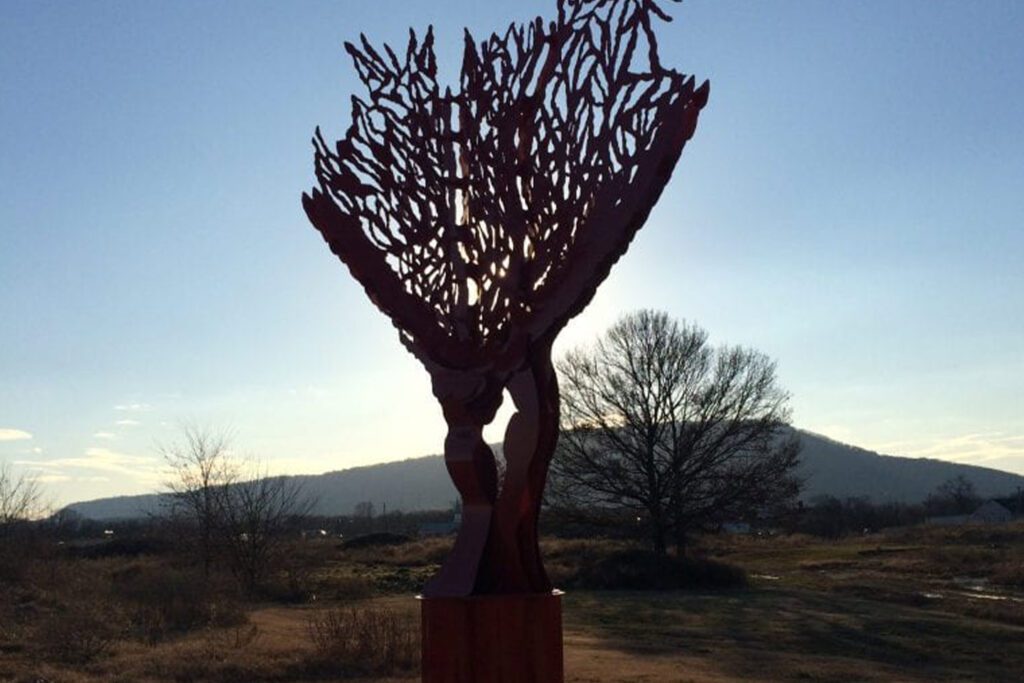 silhouette of a Sculpture with lookout mountain in the background