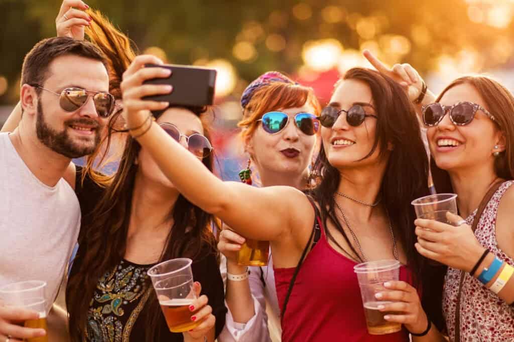 women posing for a picture with beer in their hands