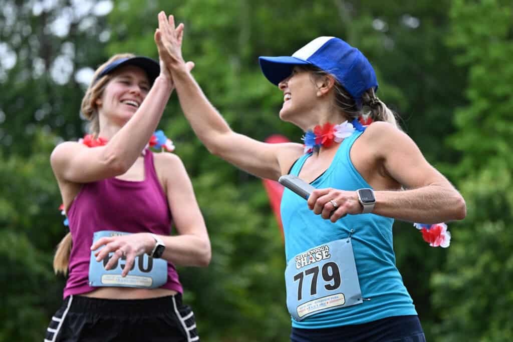 two women high-fiving