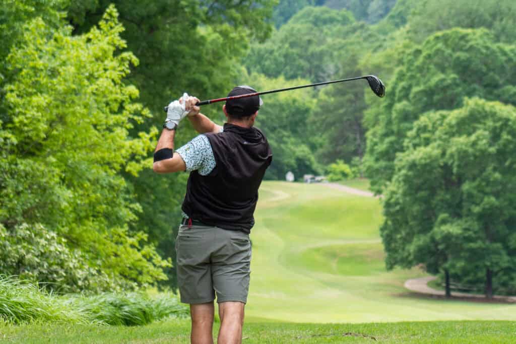 man golfing on a golf course