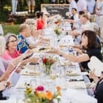 Picture of women eating at Crabtree Farms around a table .