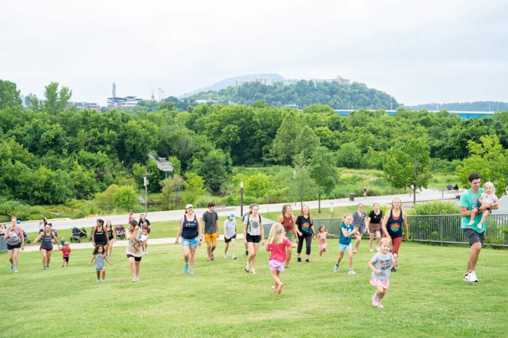 A group of people running up a hill