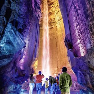 Cave with lighting coming down the middle to show the crowd.