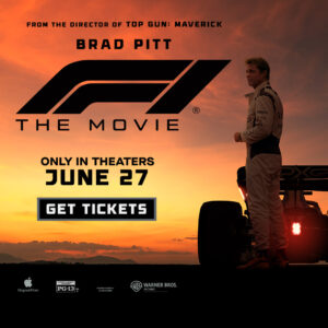 A silhouetted race car driver stands beside a sleek car against a sunset, promoting "F1: The Movie" releasing June 27.