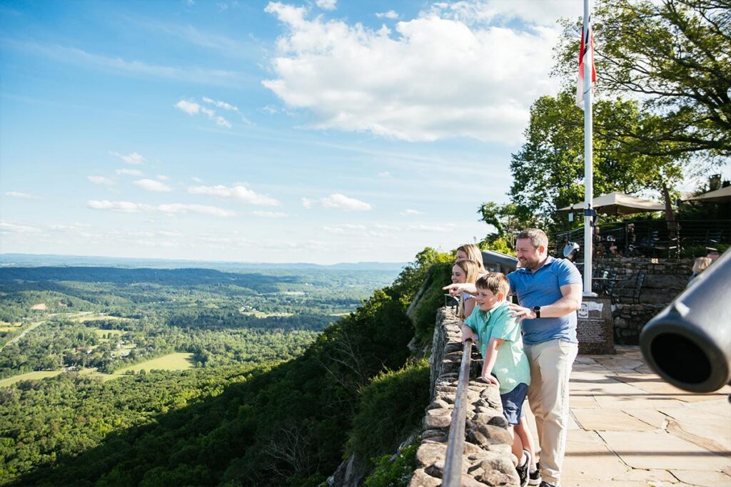 Family looking out over rock city view