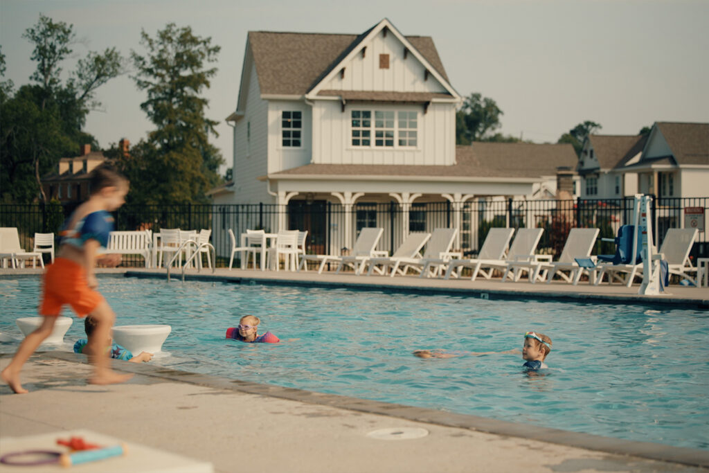 Kids swimming in a community pool
