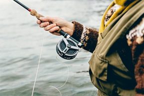 Woman Holding Fly Fishing Rod